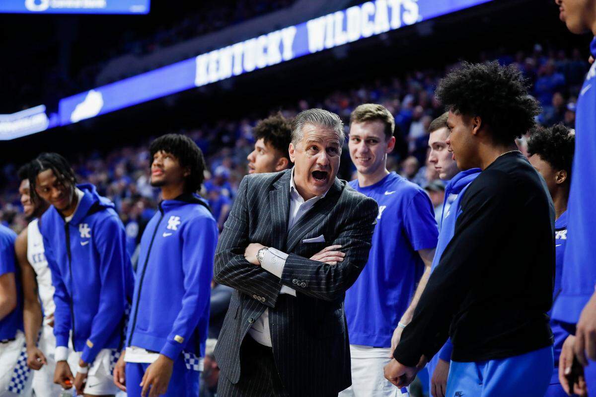 Kentucky Wildcats head coach John Calipari talks to Kentucky Wildcats guard Sahvir Wheeler (2) on the bench after a play against the LSU Tigers during the game at Rupp Arena in Lexington, Ky., Wednesday, February 23, 2022.