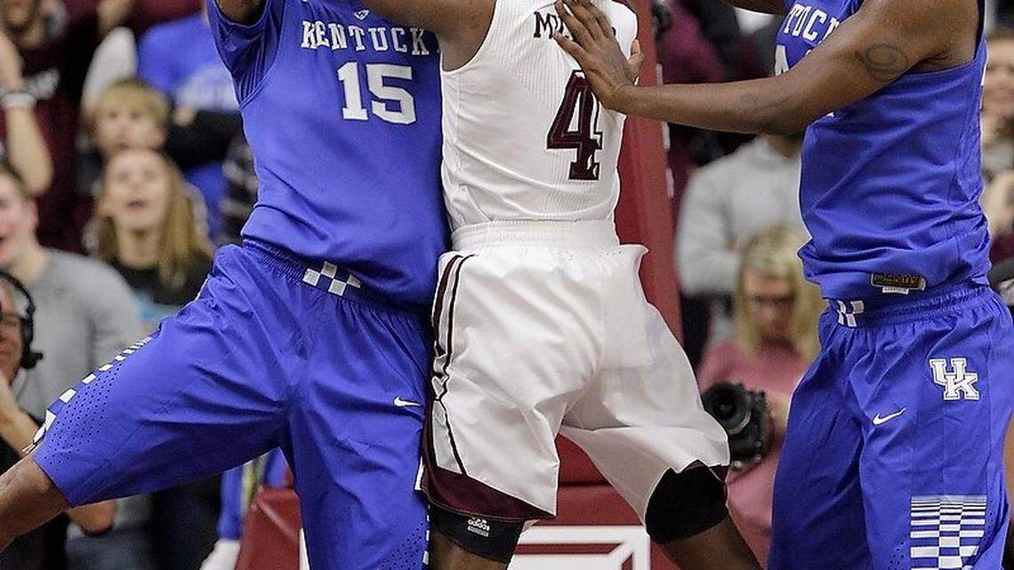 Kentucky's Willie Cauley-Stein (15) and Texas A&M's Tavario Miller (4) battled for the ball in the second half of the Kentucky at Texas A&M men's basketball game at Reed Arena in College Station, Texas, on Jan. 10, 2015. Kentucky beat the Aggies 70-64. Photo by Pablo Alcala | Staff