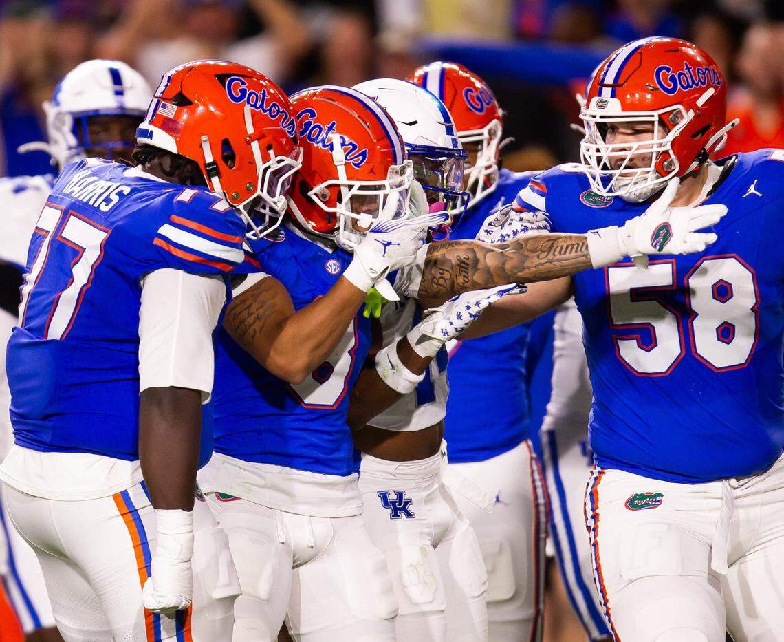 Florida Gators wide receiver Eugene Wilson III (3) signals a first down after hauling in a big pass play under Kentucky Wildcats defensive back JQ Hardaway (6) during the first half at Ben Hill Griffin Stadium in Gainesville, FL on Saturday, October 19, 2024 against the Kentucky Wildcats. [Doug Engle/Gainesville Sun]