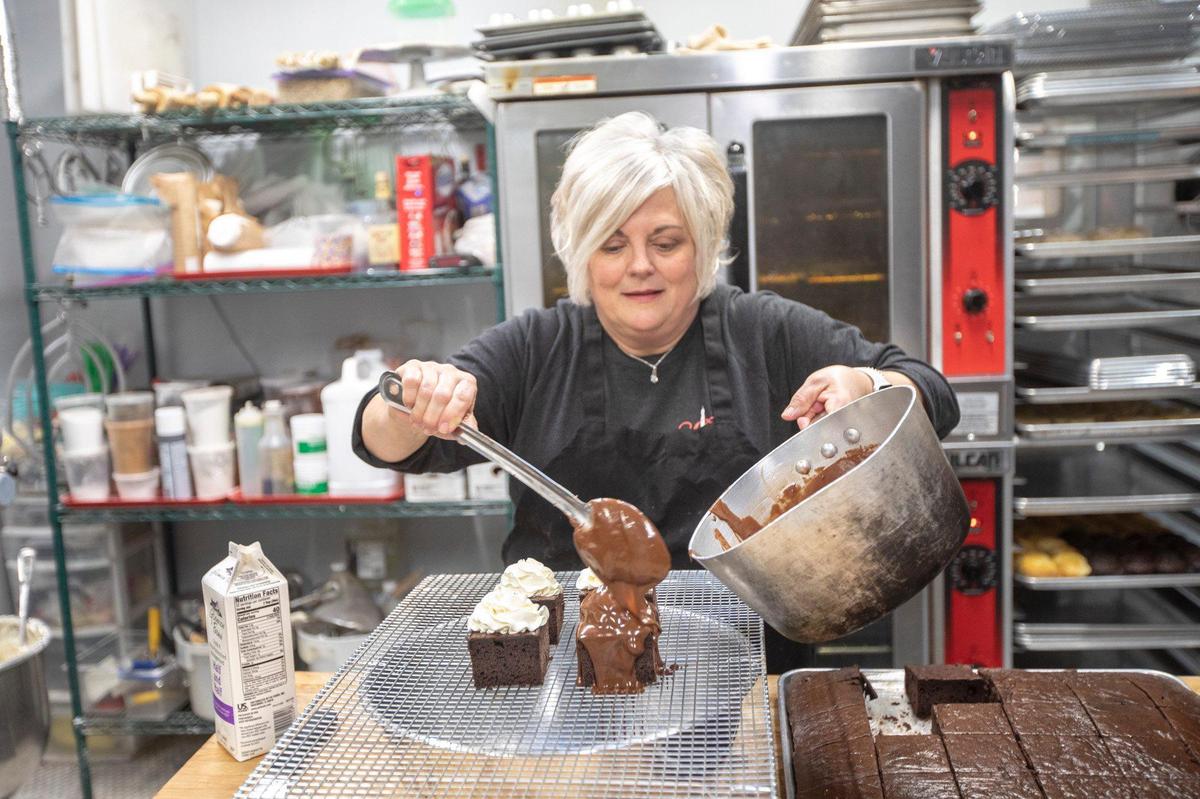 Beth Carter, owner of B’s Bakery, makes a “Cake with a plop on top” - homemade cream atop chocolate cake covered in more chocolate.
