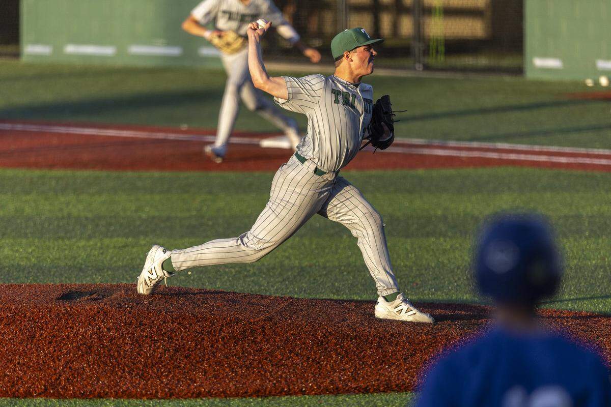 Trinity's Grayson Willoughby pitches during a game at Lexington Catholic High School on May 12.