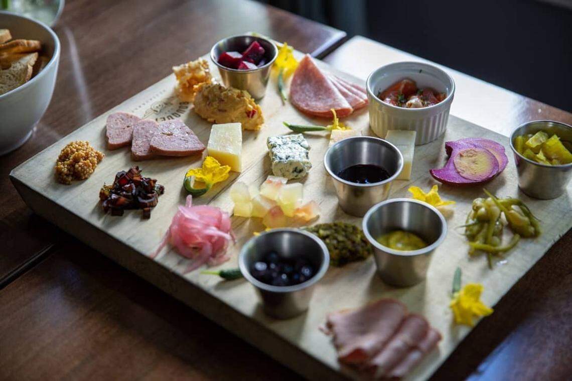 The Motherboard at Bouquet Restaurant in Covington. Chef Stephen Williams is known for his “boards” offering five different kinds featuring cured and smoked meats, cheeses, spreads and a plethora of pickled things.