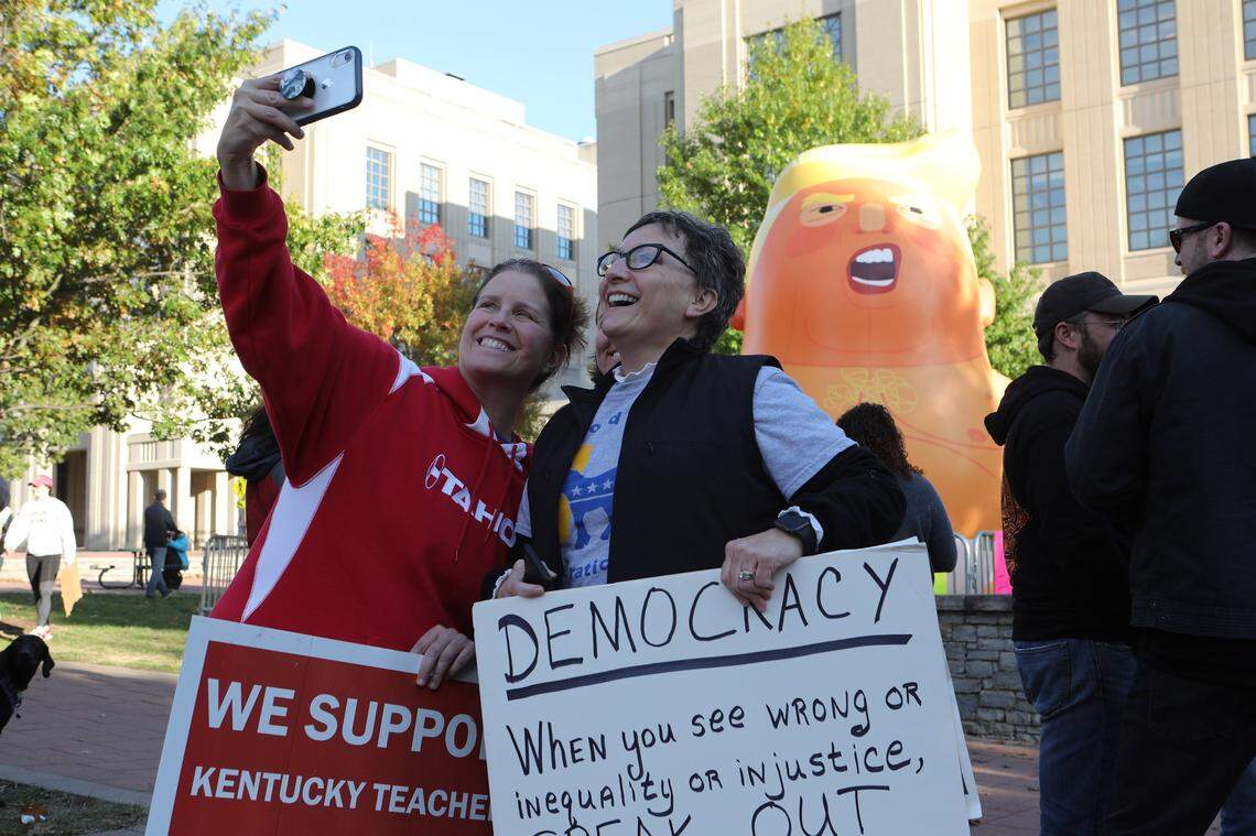 Pam Duncan and Pam Duncan took a selfie with the Baby Trump balloon at Courthouse Plaza in Lexington Monday, Nov. 4, 2019.