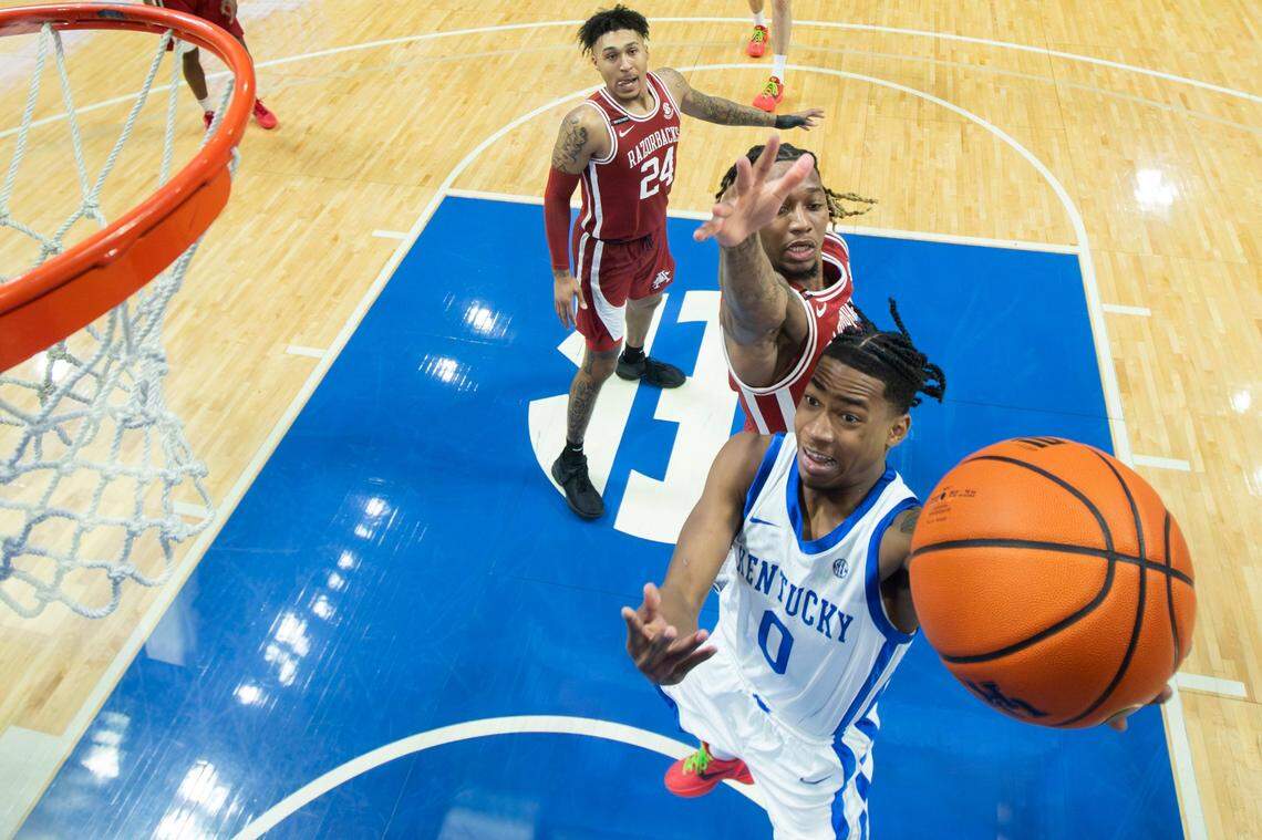 Kentucky guard Rob Dillingham (0) attacks the basket against Arkansas at Rupp Arena on March 2.