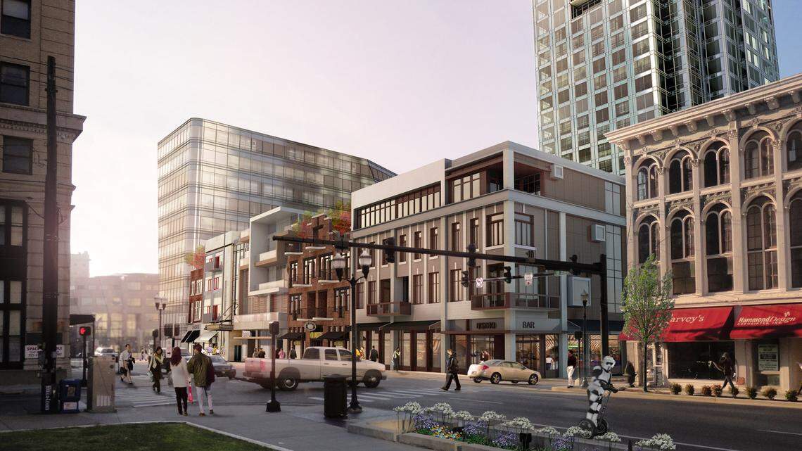 The plan for the  CentrePointe project calls for four smaller  buildings along Main Street. This  rendering shows the view at Upper and Main streets from the old  courthouse.    