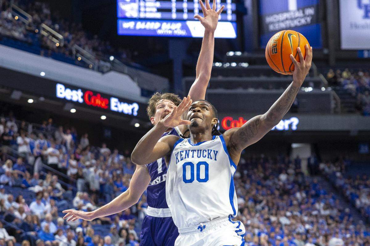Kentucky’s Otega Oweh (00) drives past Kentucky Wesleyan’s Alex Gray during Wednesday night’s exhibition game in Rupp Arena. Oweh started the game and finished with 18 points.