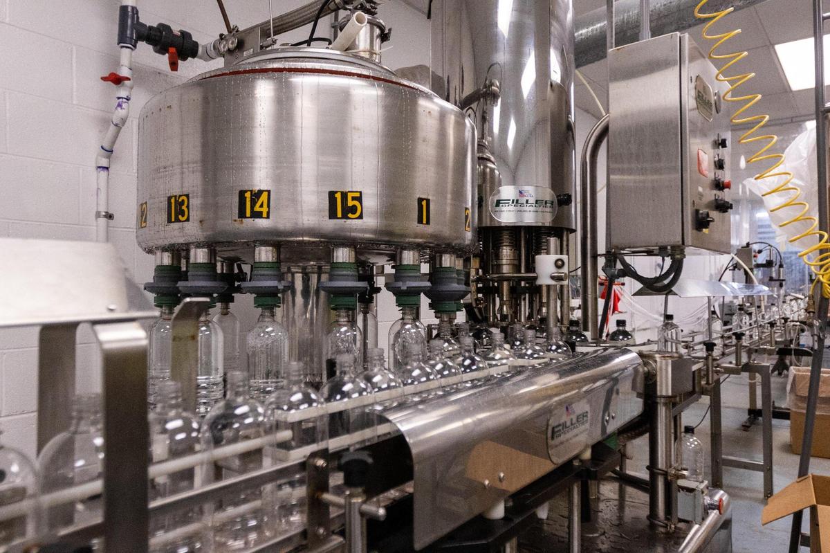 A machine fills plastic bottles with water at the Highbridge Springs underground bottling facility in Wilmore, June 2, 2022.