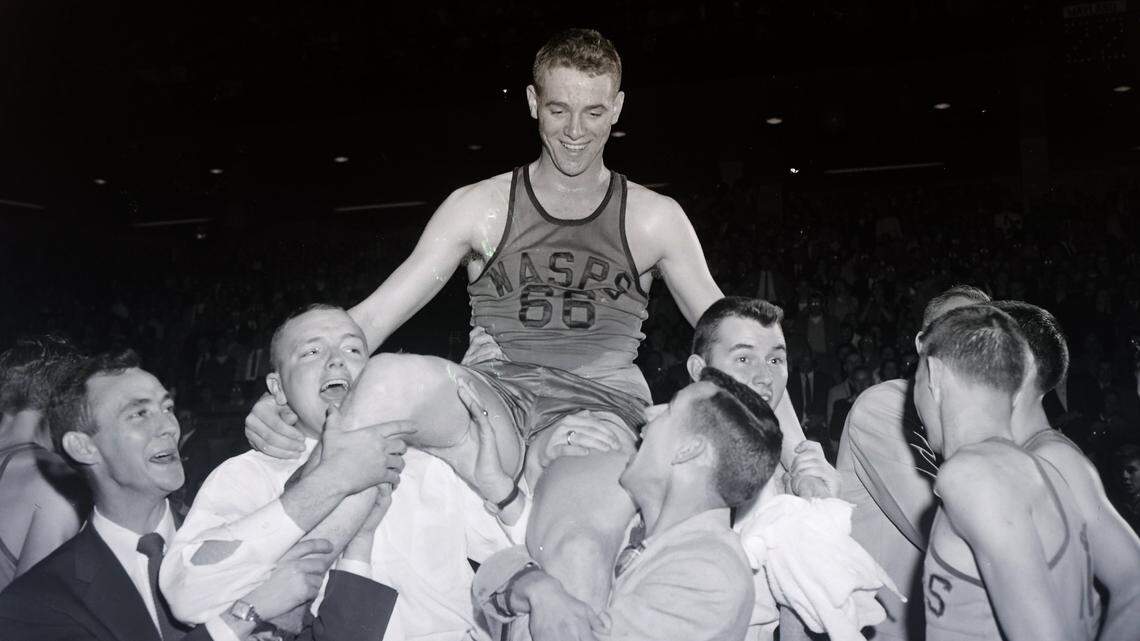 Wayland basketball star Kelly Coleman (66) was carried from the floor after he set an all-time scoring record of 185 points in the KHSAA Sweet Sixteen at Memorial Coliseum in 1956.