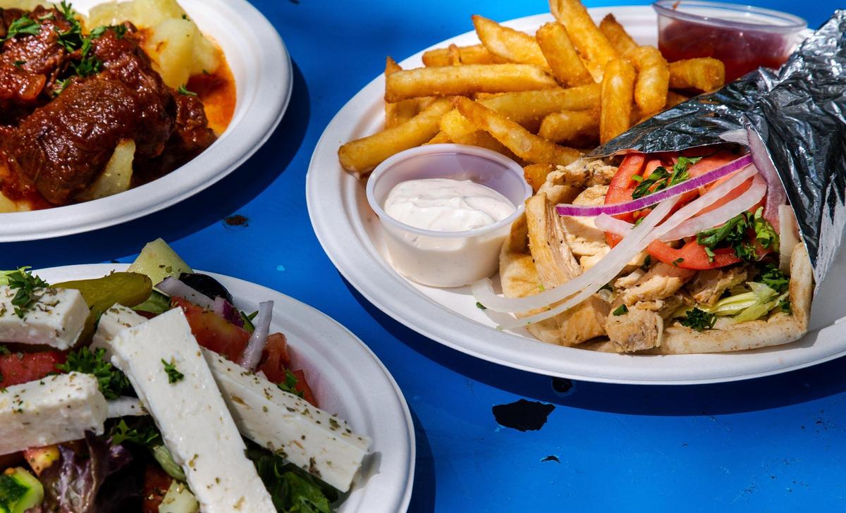 Originally a food truck, Lexington’s Athenian Grill has made a name for itself in Lexington with authentic Greek cuisine, fast-food style. Pictured here is the chicken gyro, a Greek garden salad, and Greek beef stew (kokinisto).