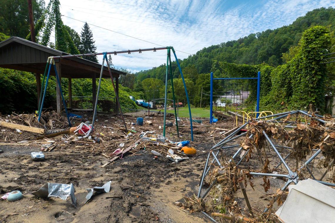 Mud and debris cover playground equipment at Neon City Park in Fleming-Neon, Ky., on Wednesday, Aug. 3, 2022.