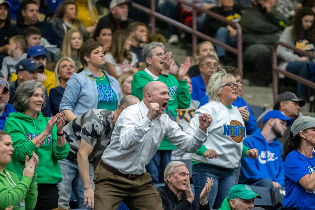 Jeff Sheppard (white shirt) cheers during the 13th Region Tournament championship game. Jeff’s son, Reed, is a UK basketball commit.