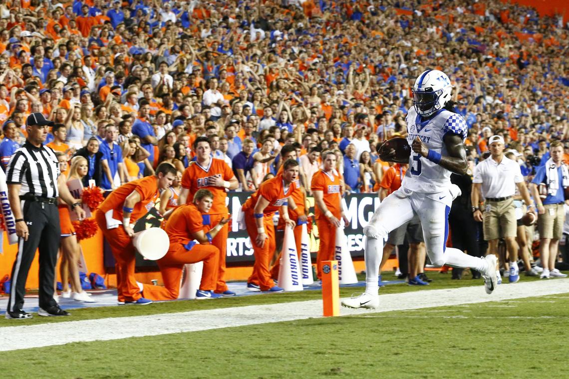 Kentucky Wildcats quarterback Terry Wilson (3) scored a touchdown during a game against the Florida Gators Saturday at Ben Hill Griffin Stadium in Gainesville. Kentucky beat Florida 27-16.