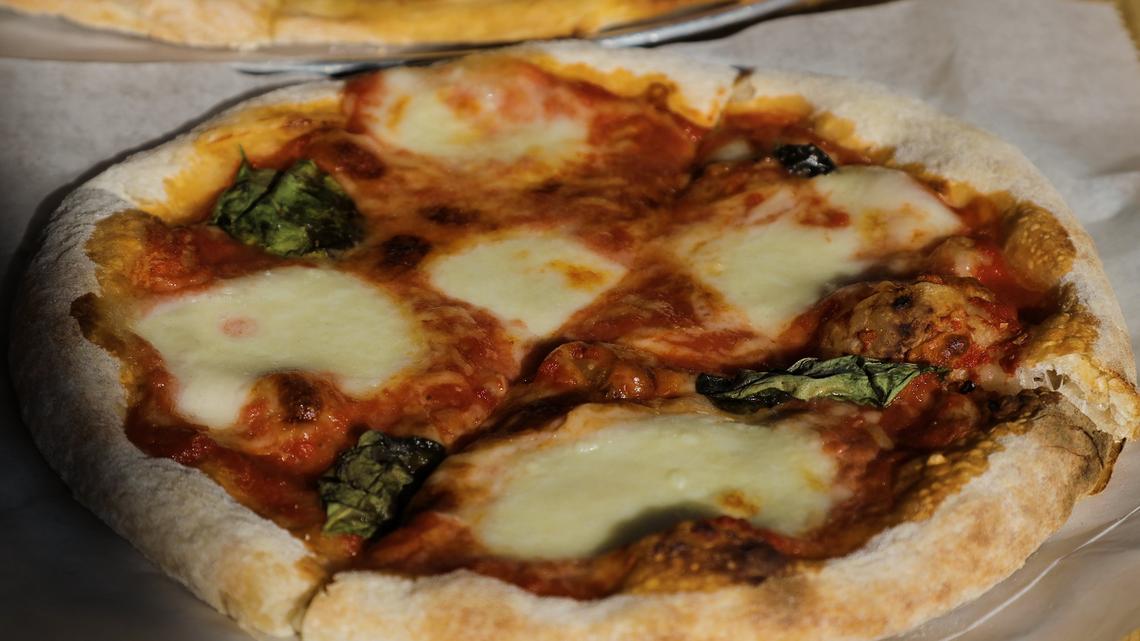 A small Margherita pizza from Tomatoes and Flames pizza restaurant in Mt Sterling. Neapolitan-style pizzas are cooked in just 90 seconds thanks to the 800 degree temperature of the wood-fired oven.