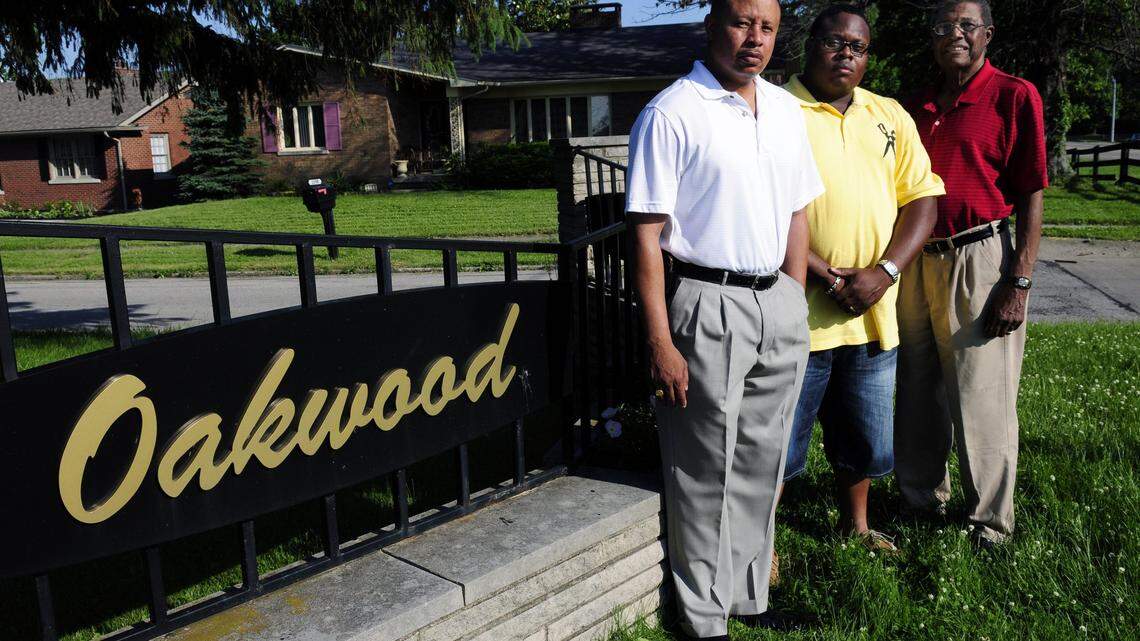 Three generations of the Jackson family are Oakwood subdivision homeowners, and Brian, 27, in the middle, lives in the house where his great-grandmother once lived. Brian’s father, Jarold Jackson, 51, is at left. His grandfather, Julian Jackson Jr. turns 78 on Wednesday. Oakwood “has been a pleasant place to live,” said Julian Jackson, who was one of the first people to buy a home there when the subdivision opened off Georgetown Road in 1964. Photo by Tom Eblen | teblen@herald-leader.com
