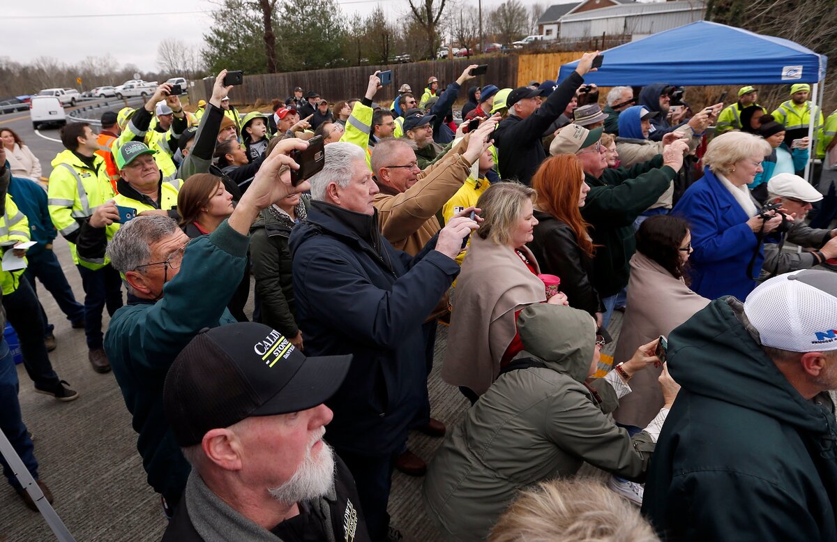 The crowd took photos during a ceremony to officially open the new Kennedy Mill Bridge that spans Herrington Lake between Garrard and Mercer counties on KY 152. The bridge was done roughly a year ahead of schedule because the crews put in longer hours at a higher cost.