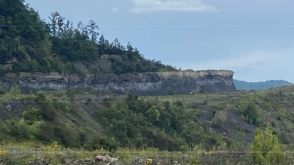 Companies affiliated with West Virginia Gov. Jim Justice had not properly reclaimed several Eastern Kentucky coal mines. This photo shows a highwall, or cliff, the state said was not reclaimed as required.