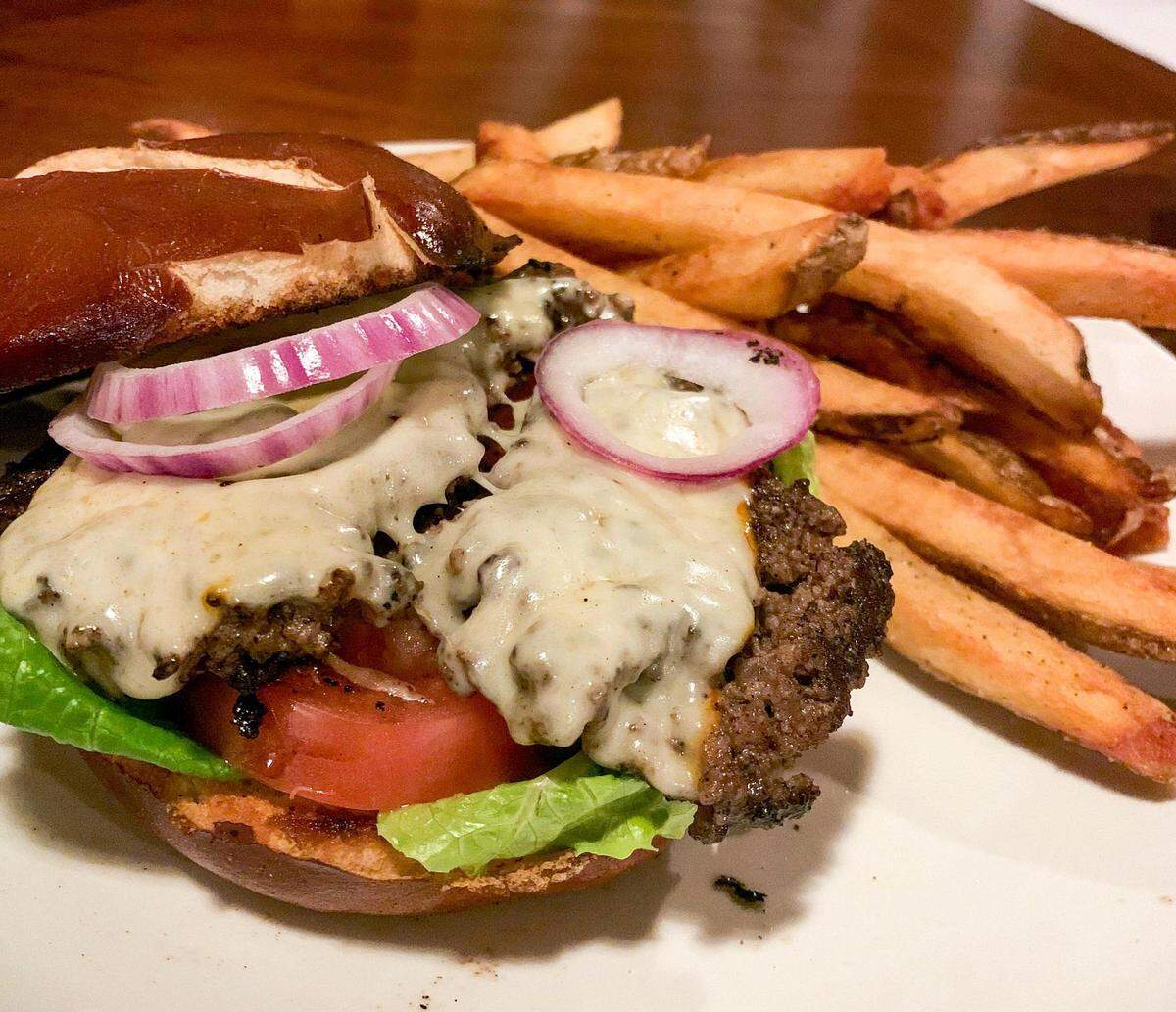 The 6-ounce Pinnacles burger comes on a pretzel bun with muenster cheese, lettuce and tomatoes with hand-cut fries.