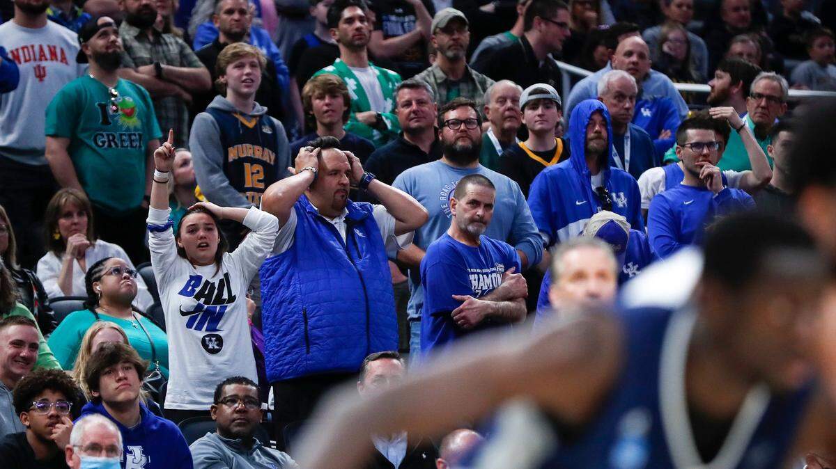 Kentucky fans looked on in shock in the final moments of the Wildcats’ 85-79 overtime loss to Saint Peter’s in the NCAA Tournament round of 64.