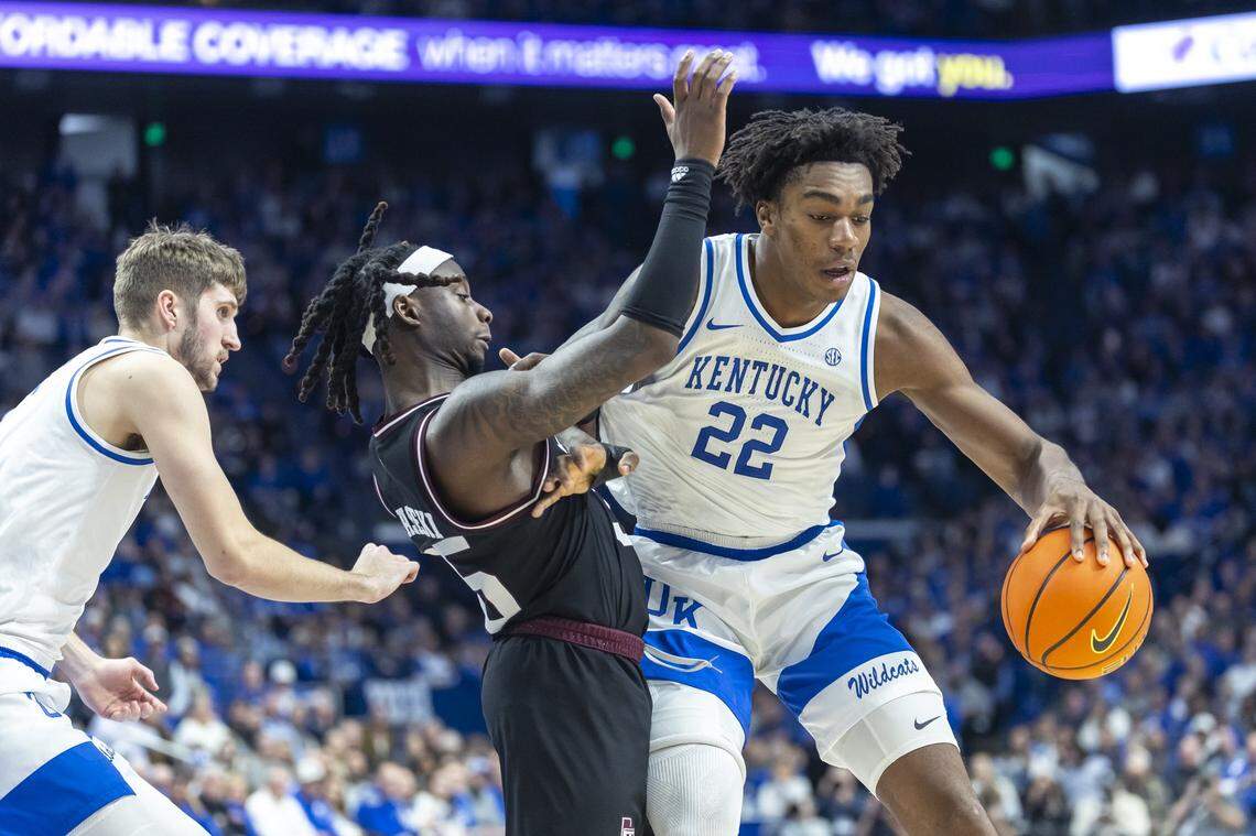 Kentucky center Amari Williams (22) drives the ball toward the basket as Texas A&M guard Manny Obaseki (35) defends during Tuesday’s game at Rupp Arena.