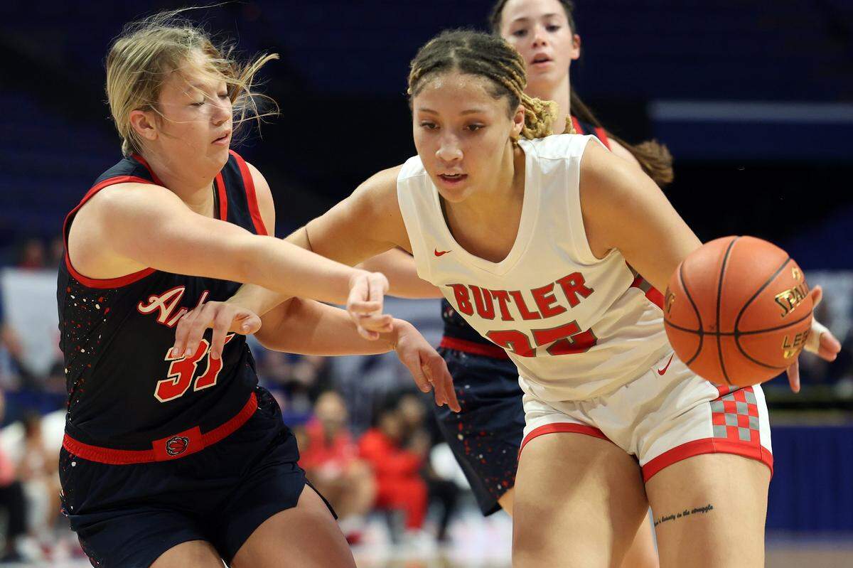 Butler’s Mariah Knight, right, drives against Anderson County’s Lainey Johnson (31) during their first-round matchup. Knight finished with 10 points, four rebounds, two assists and two blocks. Johnson scored 17 for Anderson County before fouling out.