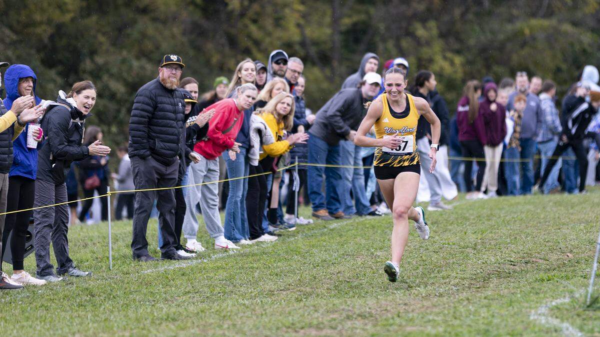 Woodford County senior Addison Moore closes out the sixth first-place finish of her varsity career at the girls Class 3A, 6th Region Cross Country Championships at Shelby County Cross Country Course in Shelbyville on Saturday.