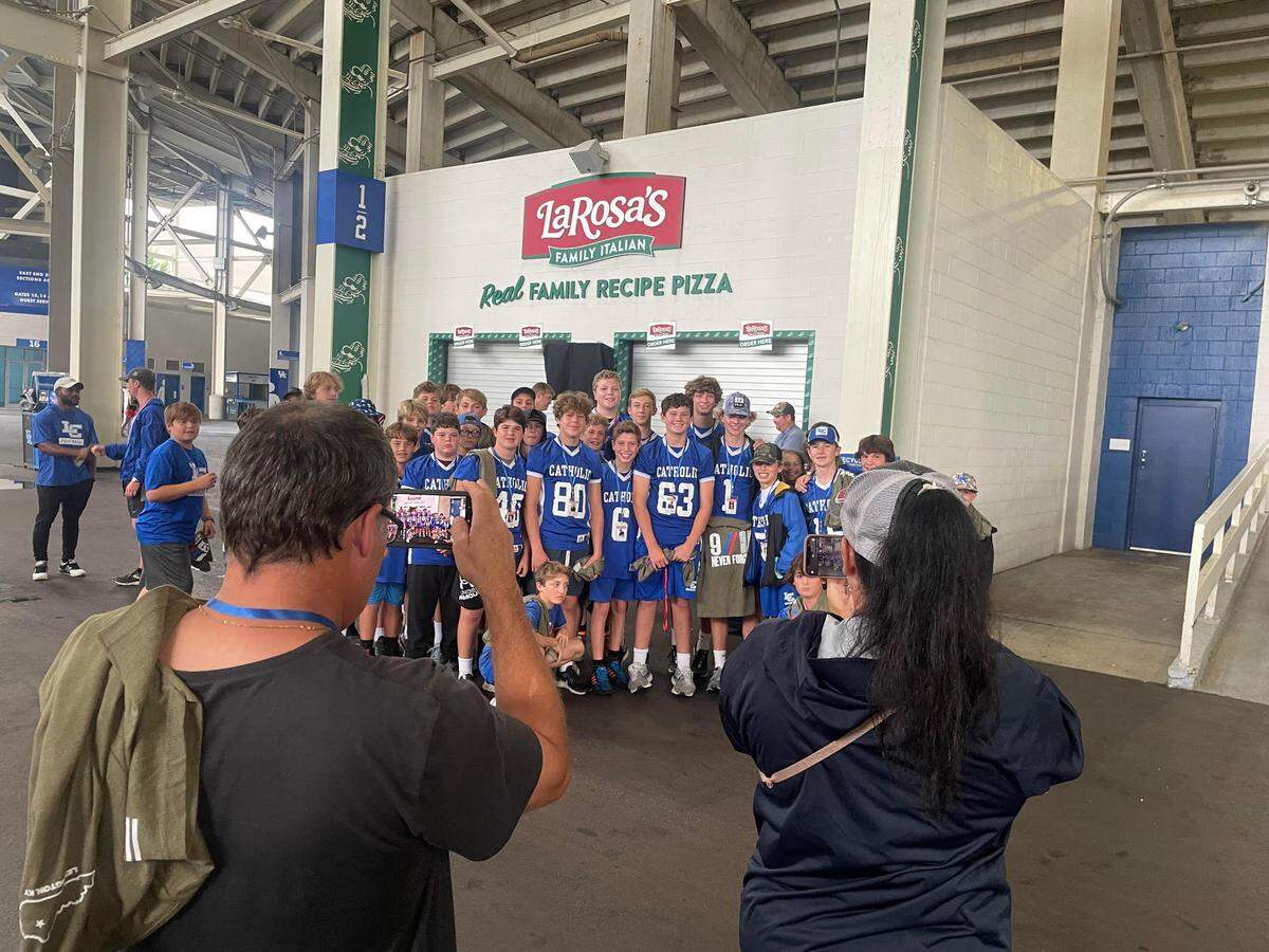 The Lexington Catholic Middle School Football Team participated in the event, which the head coach said was a team effort, and spoke to their group values.