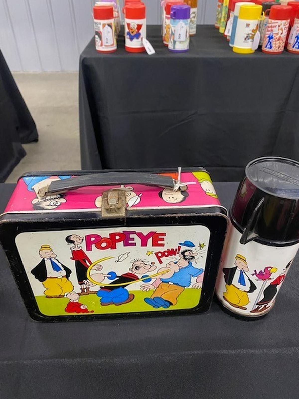 The collection includes lunchboxes that cover just about everything in 20th century pop culture including cartoons such as Popeye.