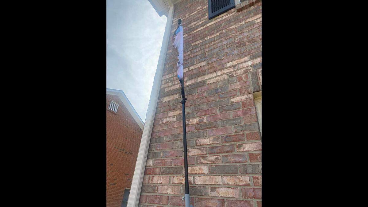 James Grant Wilson shared a photo of what was left of the pride flag that was burned outside his house.