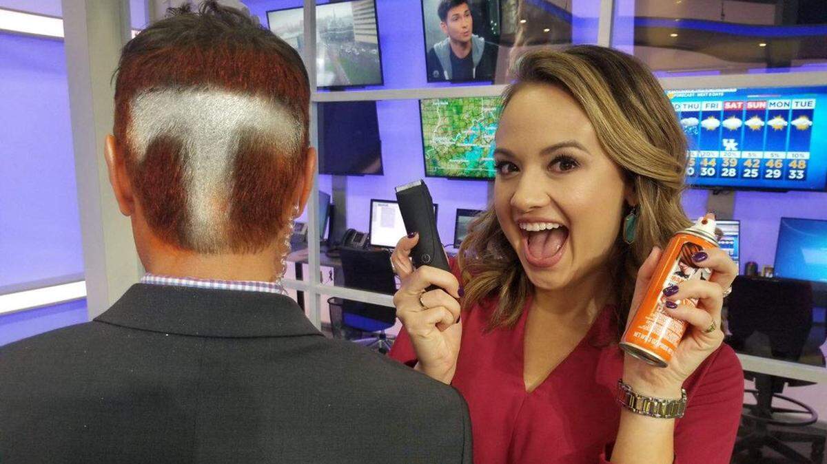 Hayley Harmon, right, gleefully showed off her handiwork in shaving a giant “T” into the hair of her “Live with Lee & Hayley” co-host Lee Cruise on Monday. Cruse lost a bet over the Kentucky-Tennessee football game on Saturday, meaning a new look was due on Monday. Harmon lost the bet last year, but only had to carry a “Kentucky Girl” vanity plate on her car for two weeks.