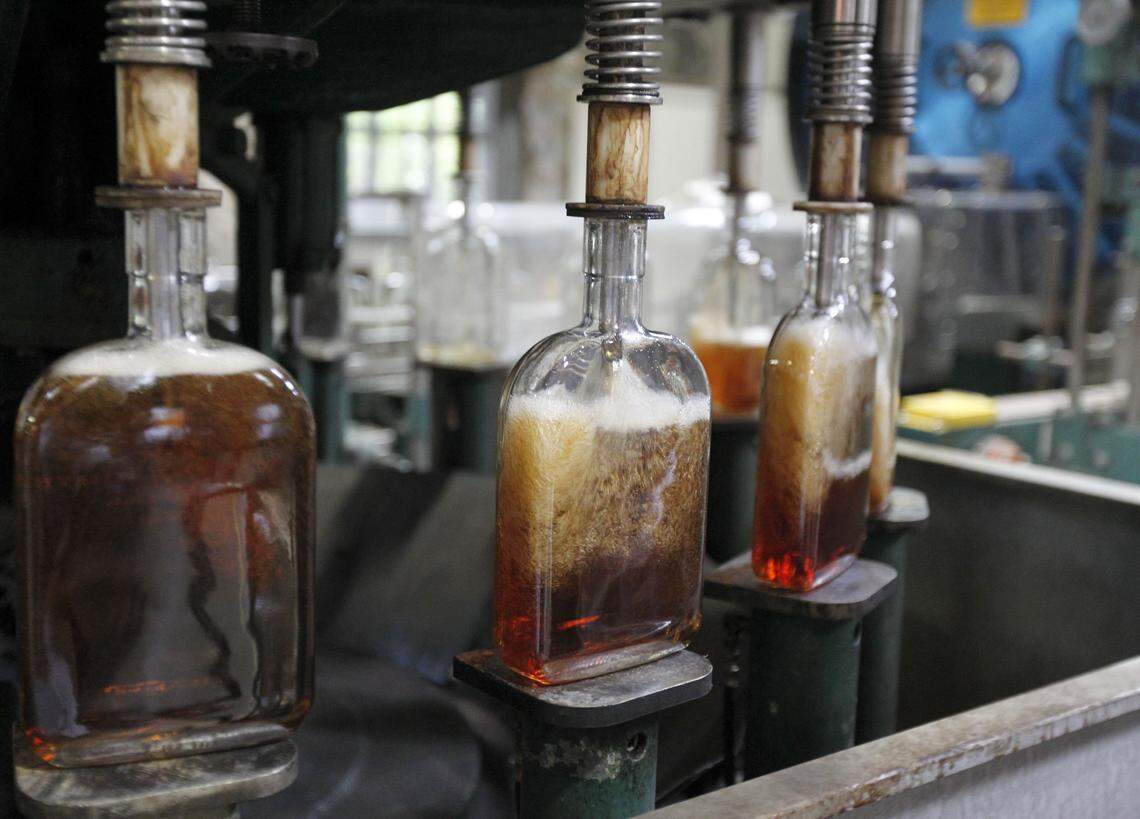Bottles are filled with Woodford Reserve bourbon on the bottling line at the Woodford Reserve Distillery near Versailles July 24, 2013. 