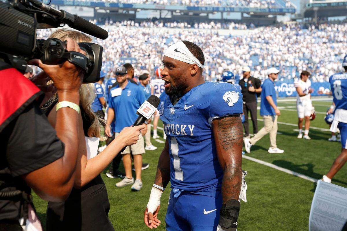 Kentucky running back Ray Davis (1) talks with reporters after his team’s 33-14 defeat of Florida on Saturday at Kroger Field.