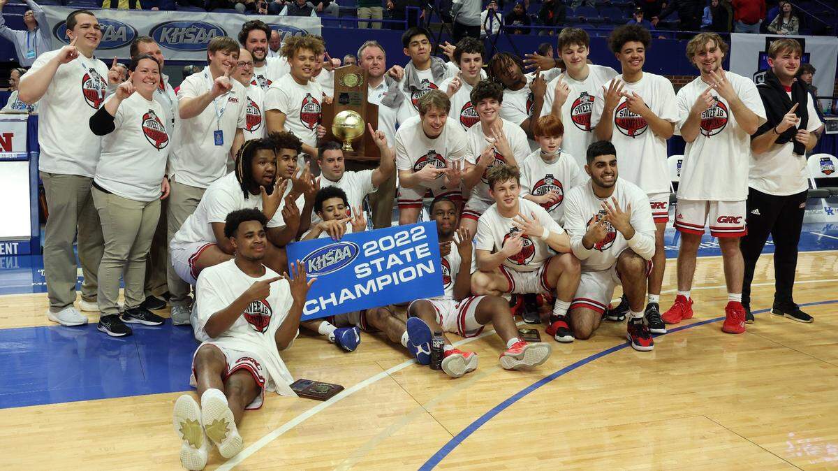 Clark County team and staff pose with the trophy after winning the championship of the UK Healthcare Boys’ Sweet 16 at Rupp Arena in Lexington, Ky., Saturday, March 19, 2022. (Photo by James Crisp)