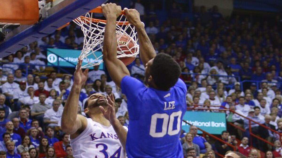 Kentucky's Marcus Lee delivered a dunk in the second half of the game against Kansas Saturday night.