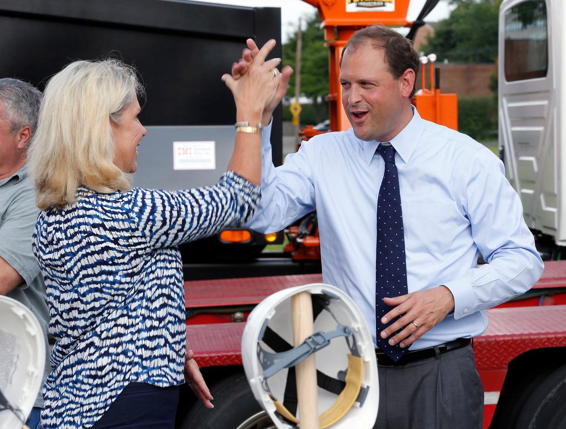 Town Branch Park Advisory Board Chair Ann Bakhaus high-fived Congressman Andy Barr during a groundbreaking ceremony for Town Branch Commons held Monday morning in Charles Young Park. Town Branch Commons will be a strip of Bluegrass running through downtown Lexington. This winding park and trail system will roughly follow the path of Town Branch, Lexington's first water source, which is located in a culvert under modern-day Vine Street.