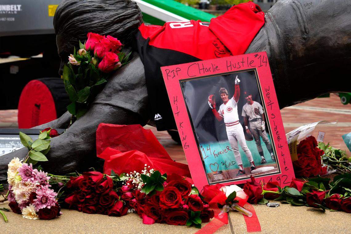 As word spread of the death of former Reds player/manager Pete Rose at 83, many came to downtown Cincinnati on Tuesday to pay their respects at the statue of Rose at the entrance of Great American Ballpark.