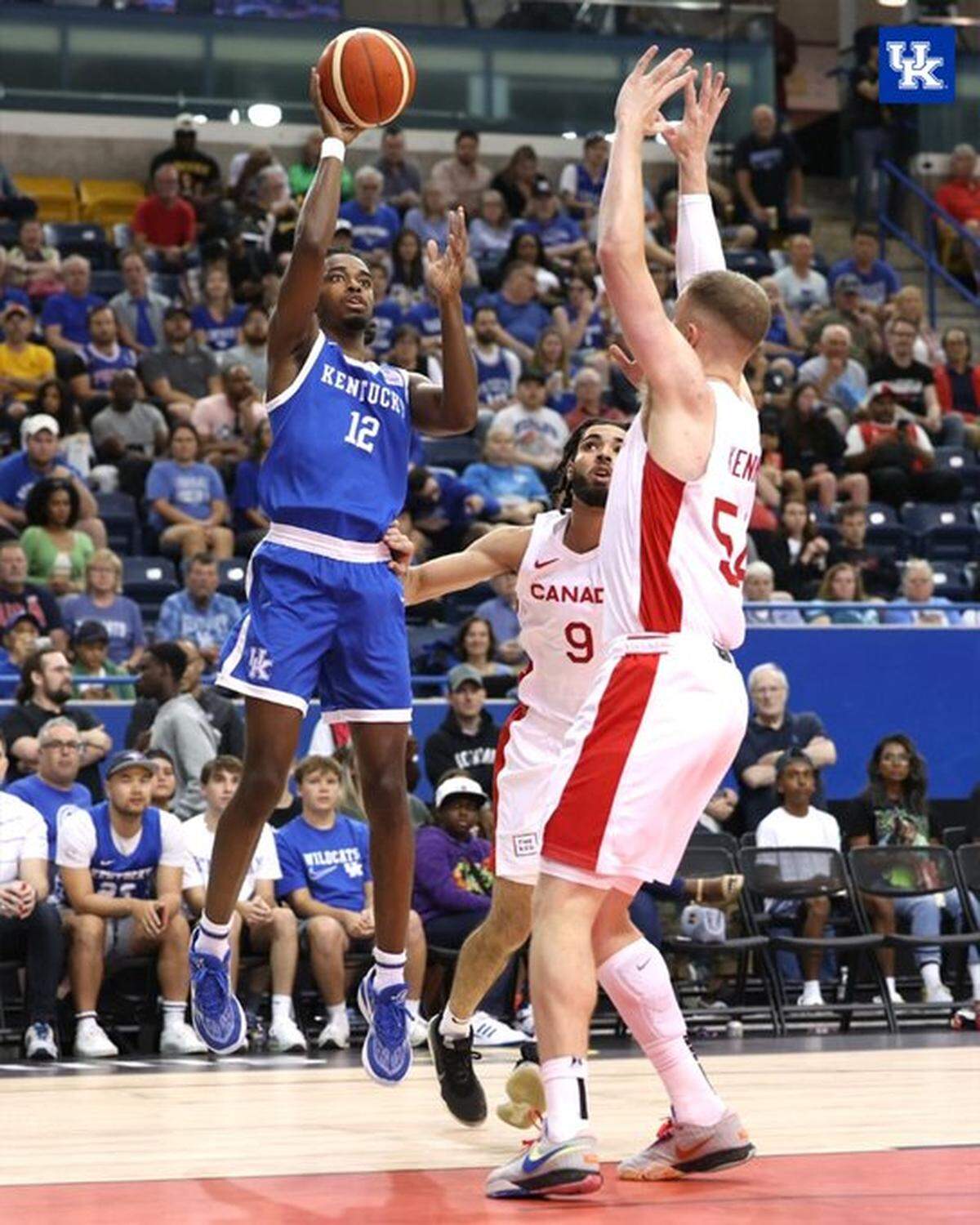 Antonio Reeves puts up floater against Canada’s Thomas Kennedy (54) and Addison Patterson (9) during Thursday night’s game in Toronto.