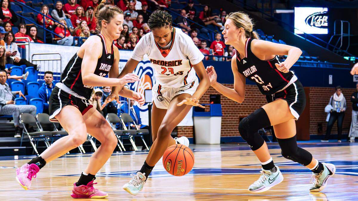 Frederick Douglass’ Jaelee Knowles (23) tries to beat a double-team during Friday’s Sweet 16 quarterfinal win over Taylor County. The Broncos take on George Rogers Clark in the state semifinals on Saturday morning.