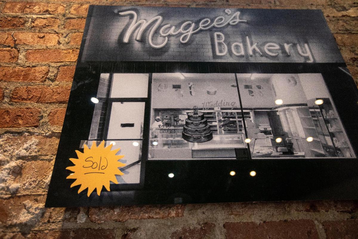 Photos, tables, chairs and baking sheets are sold to patrons on the last day of business for Magee’s Bakery in Lexington, Ky., Saturday, May 13, 2023. Some people waited in line over two hours to try and purchase baked goods or items.