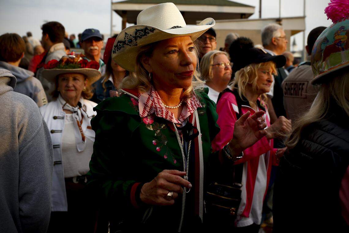 Joyce Meyer, of Louisville, Ky., watches as Kentucky Derby and Kentucky Oaks contenders make their way to the track for morning workouts at Churchill Downs in Louisville, Wednesday, May 1, 2019. Meyer said she is still undecided for a favorite horse.