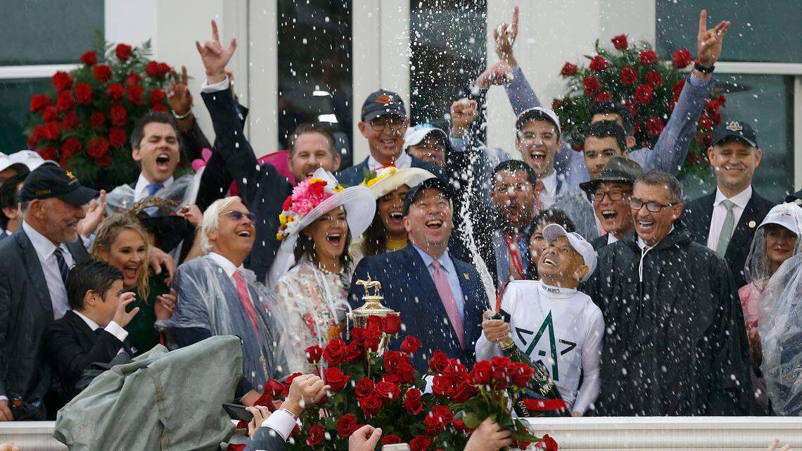 Winning jockey Mike Smith gave the winning team a champagne shower after Justify won the Kentucky Derby by 2 1/2 lengths over Good Magic on Saturday.