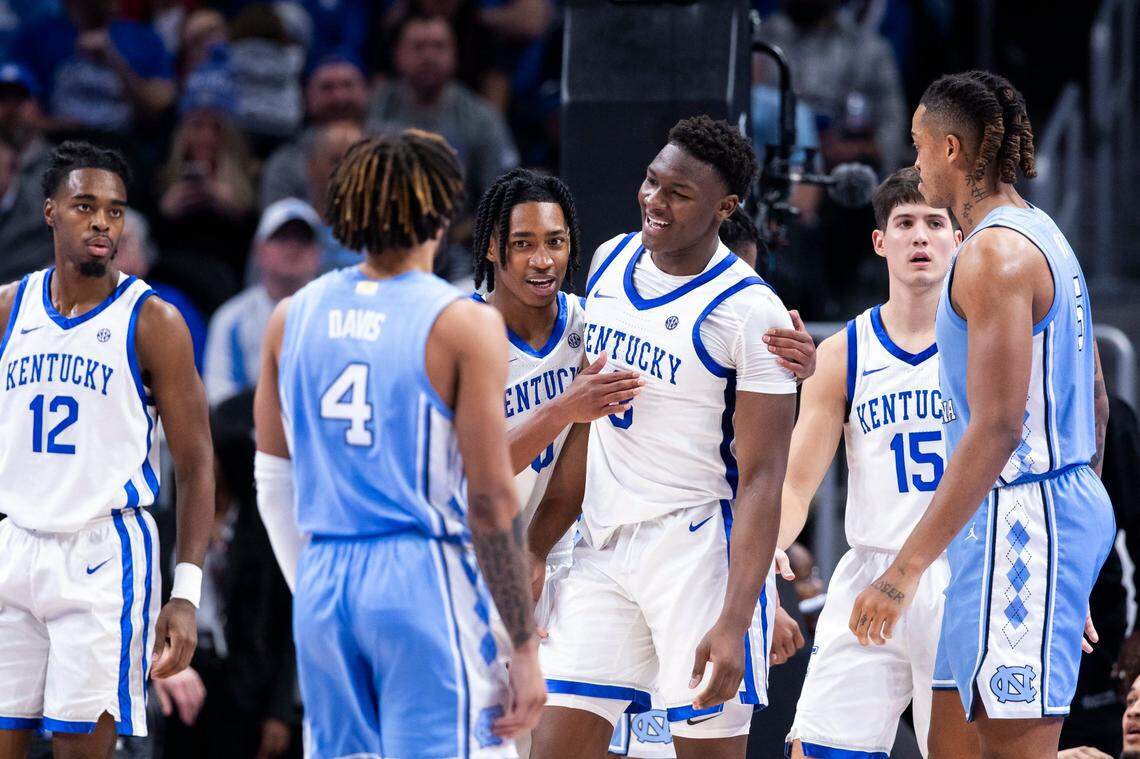 Kentucky guard Rob Dillingham embraces teammate Adou Thiero after a blocked shot against North Carolina on Saturday. Thiero is averaging 7.7 points and 5.8 rebounds per game this season.