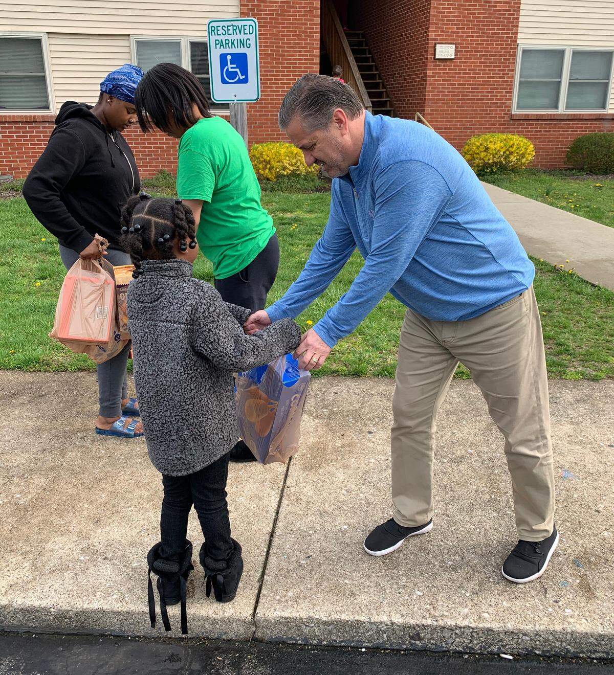 University of Kentucky men’s basketball coach John Calipari helped distribute groceries to families as part of his foundation’s work to provide assistance during the coronavirus pandemic.
