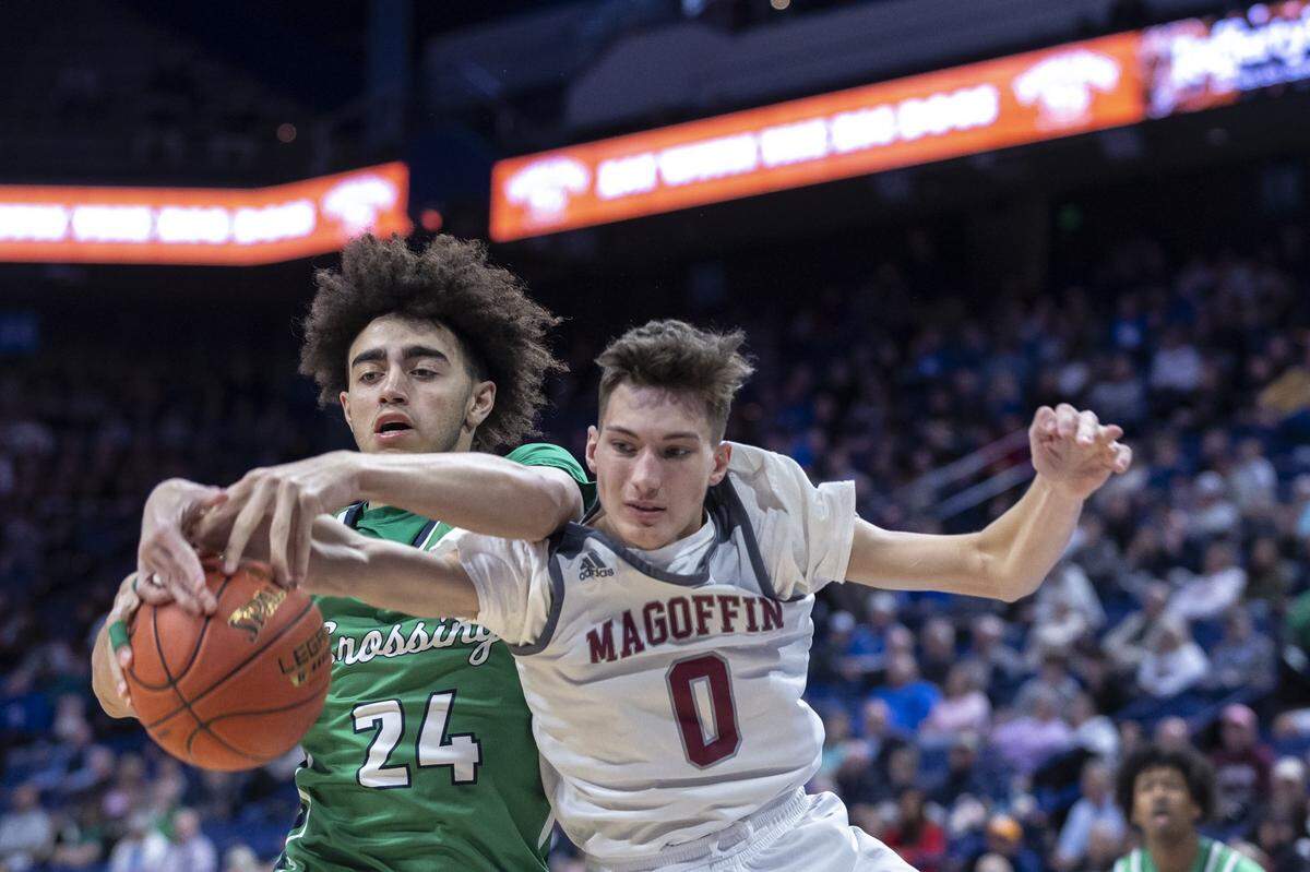 Great Crossing’s Malachi Moreno (24) and Magoffin County’s Walker Russell (0) fight for the ball during Friday’s quarterfinal game in Rupp Arena. Moreno finished with 16 points, 15 rebounds and four blocked shots. Russell had 12 points, six rebounds and four assists.