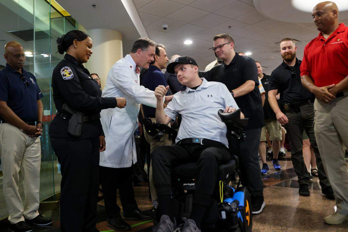 Louisville police officer Nickolas Wilt, who was shot while responding to a mass shooting at a downtown bank, leaves the hospital on July 28, 2023. Wilt was in the care of UofL Health for more than three months after the shooting. 