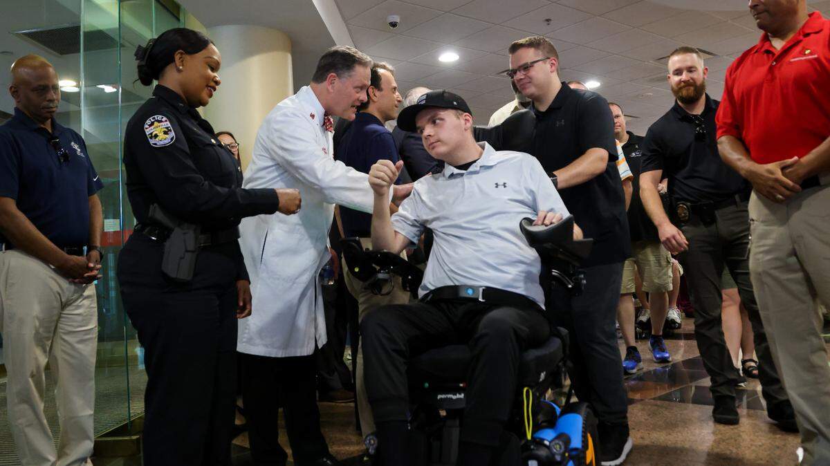 Louisville police officer Nickolas Wilt, who was shot while responding to a mass shooting at a downtown bank, leaves the hospital on July 28, 2023. Wilt was in the care of UofL Health for more than three months after the shooting. 