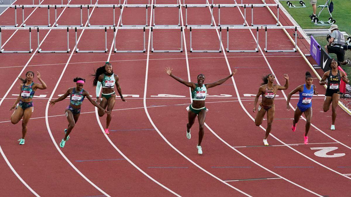 Nia Ali celebrates her victory in the women’s 100 hurdles during the USA Outdoor Track and Field Championships at Eugene, Oregon, on Saturday night. Kentucky graduates Keni Harrison (Lane 6) and Masai Russell (Lane 2) finished second and third, respectively, to also claim spots in next month’s world championships.