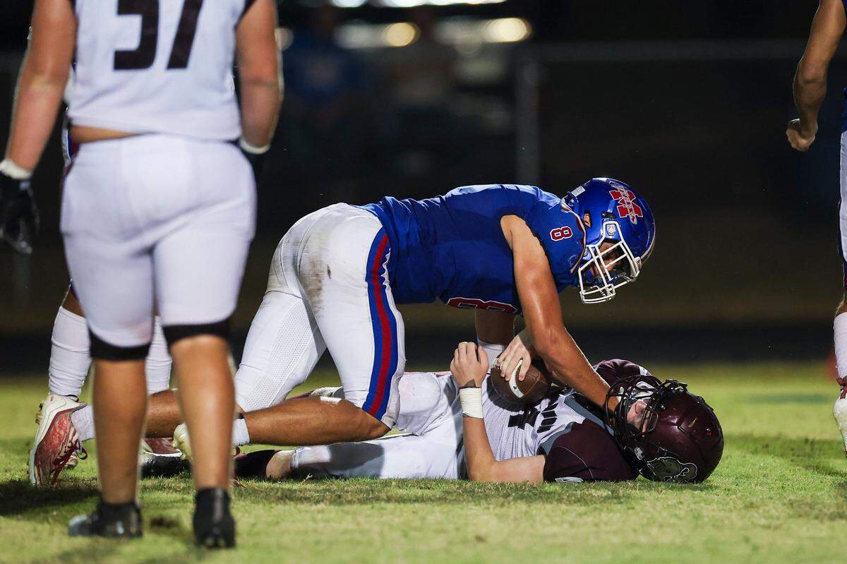 Mercer County’s Jackson Perry (8) sacks Marion County’s Wyatt Thompson during a game at Alvis Johnson Field in Harrodsburg on Friday night.