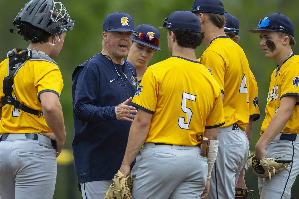 Sayre head coach Kevin Clary speaks to his team during a game against Scott County Tuesday, May 5, 2026.
