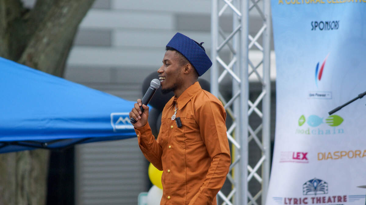A speaker at Swahili Day 2024 introduces the next musical performance. Swahili Day shared music, fashion, food and more with the Lexington community while celebrating African culture.