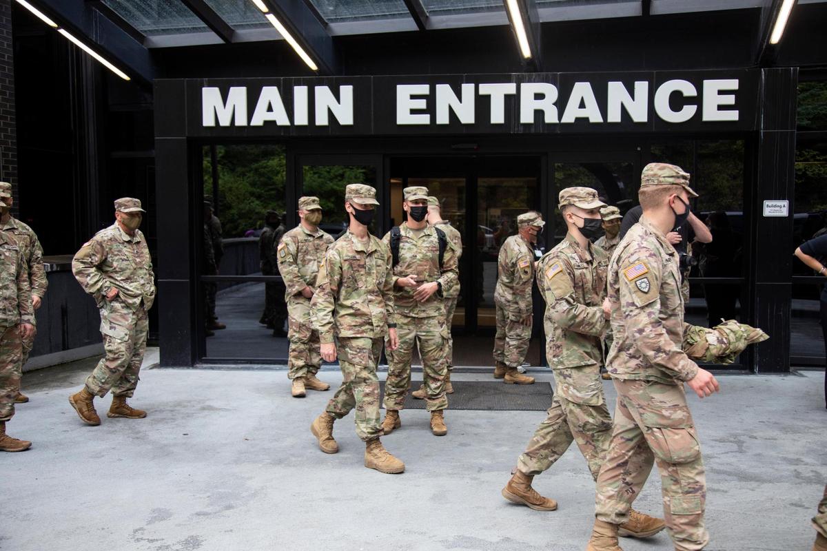 About 30 members of the Kentucky National Guard load into cars heading to get training for the month they are stationed at the Pikeville Medical Center in Pikeville, Ky., Tuesday, August 31, 2021. The soldiers will be assisting staff with non-clinical duties to free up time and resources while the Medical Center is short staffed dealing with COVID.